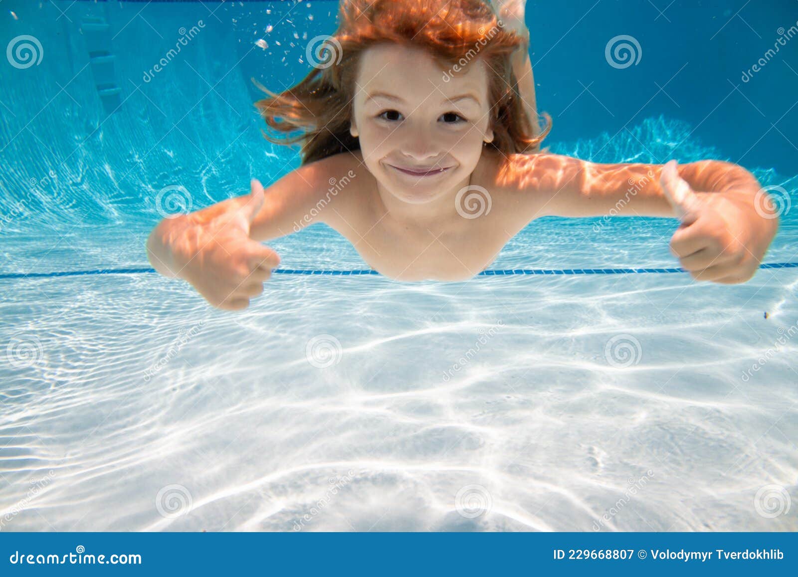 Kid in the Water Swimming Underwater and Smiling. Child Swim Under ...