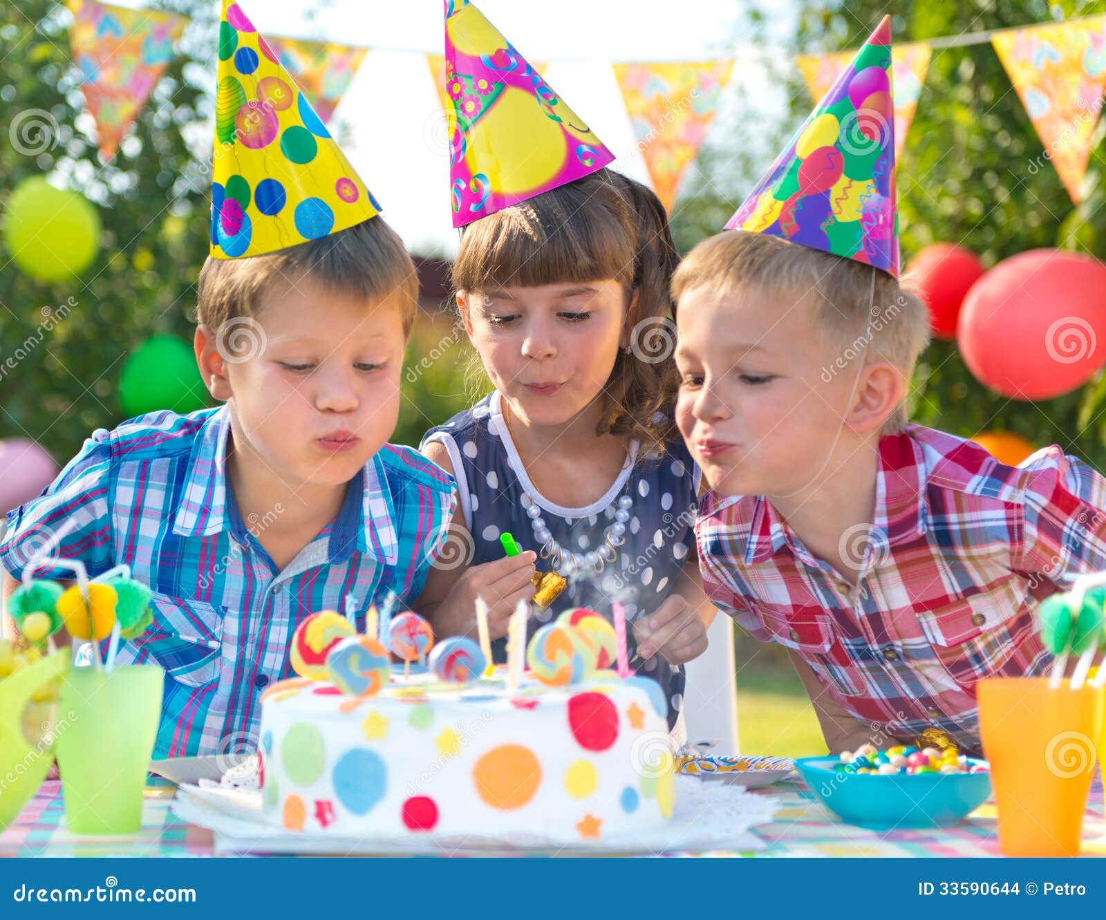Kids at Birthday Party Blowing Candles on Cake Stock Photo - Image ...