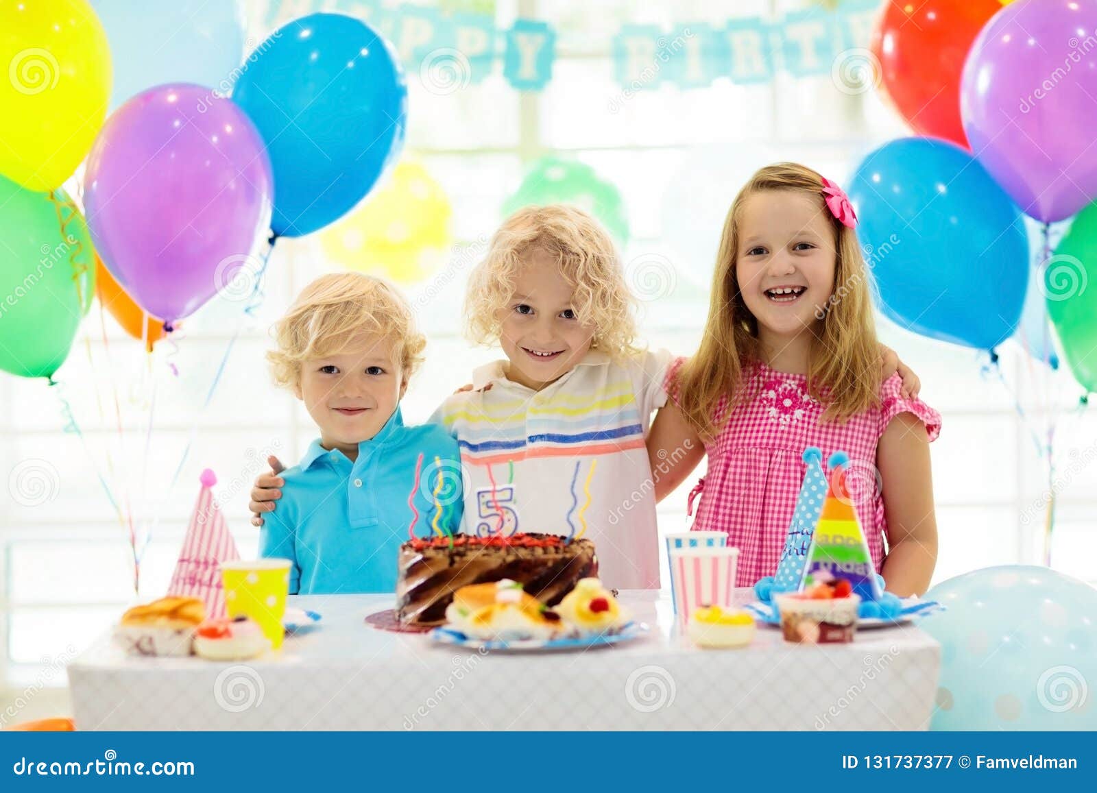 Kids Birthday Party. Child Blowing Out Candles on Colorful Cake. Decorated  Home with Rainbow Flag Banners, Balloons Stock Image - Image of curly,  group: 131737377