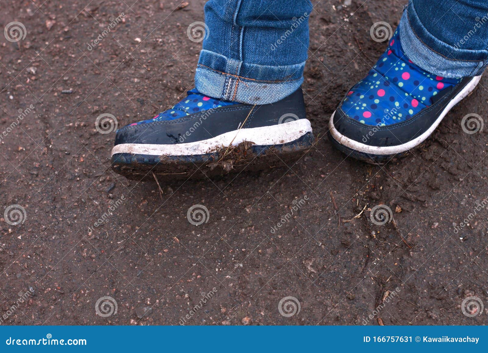 Kids Boots In Muddy Puddle. Colorful 