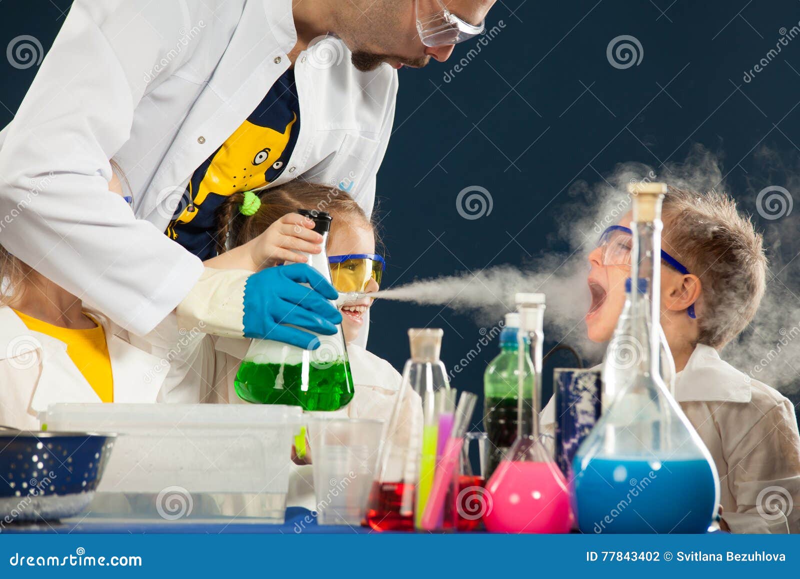 kids with crazy professor doing science experiments in the laboratory