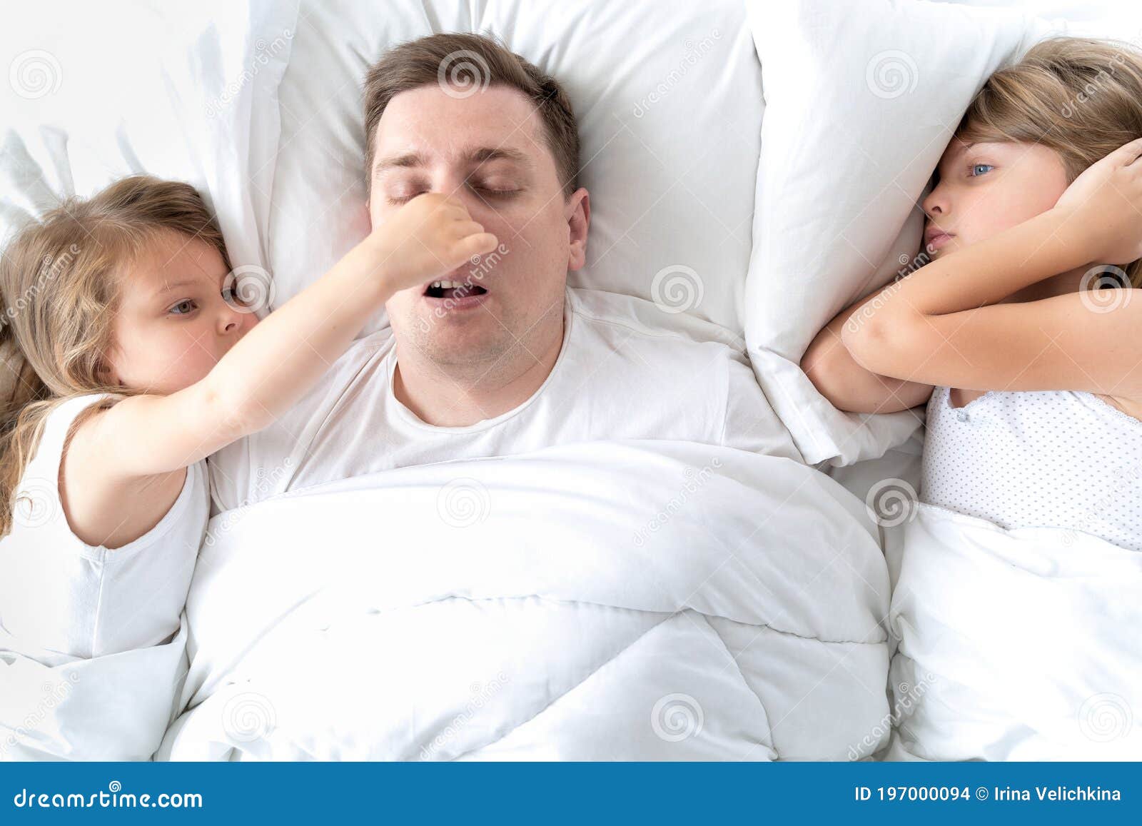 Kids, Dad Sleep Together in Bed. Father is Snoring Hard, Girls