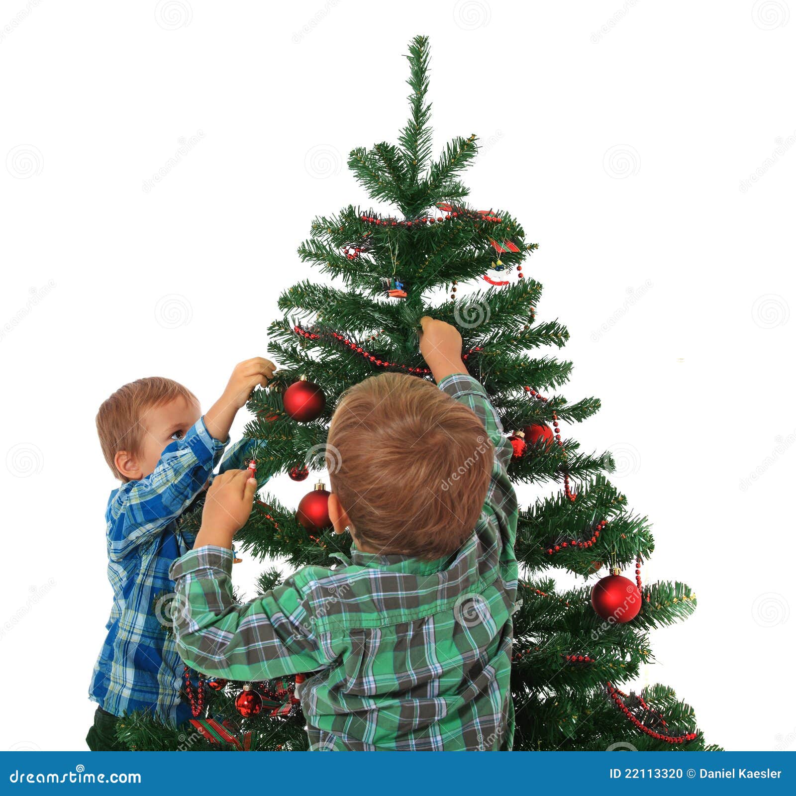 Kids Decorating Christmas Tree Stock Photo - Image: 22113320