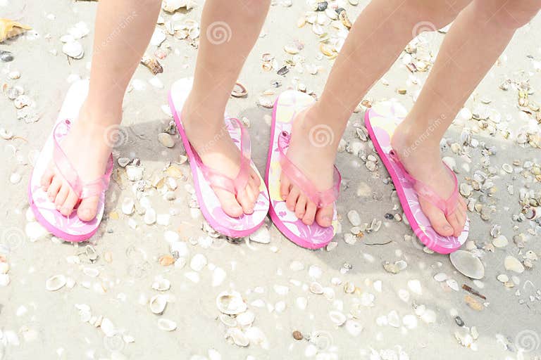 Kids feet at the beach stock photo. Image of shells, floating - 13674560