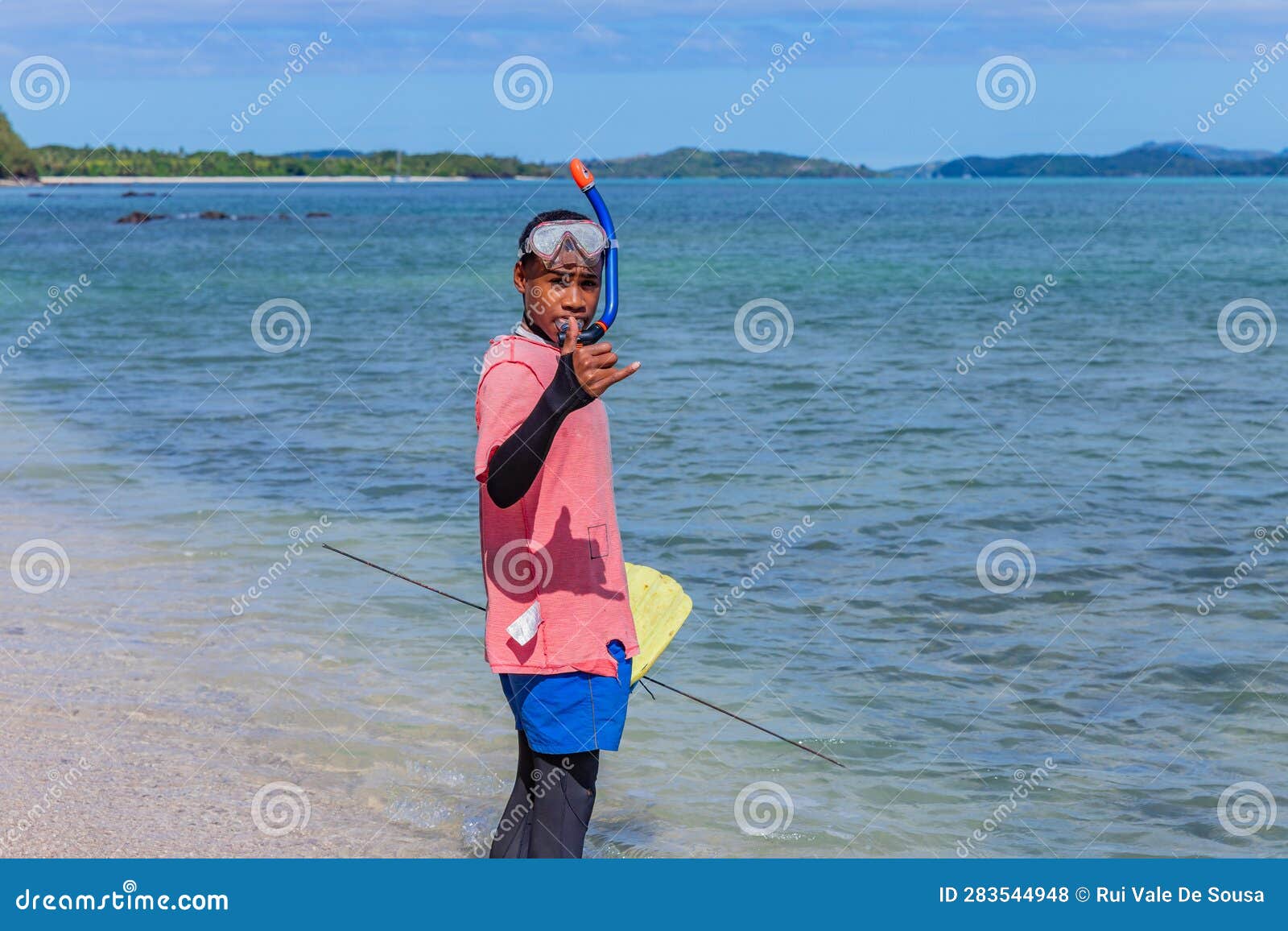 Kids fishing at the beach editorial stock photo. Image of black - 283544948