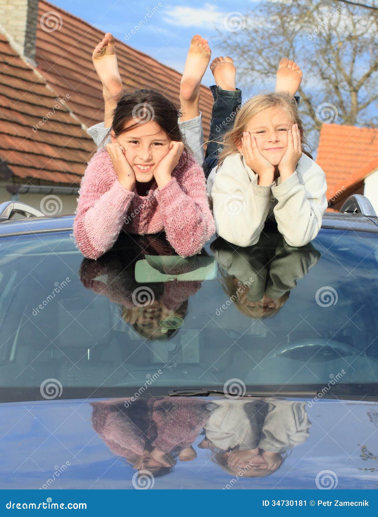 kids - girls on windscreen of a car