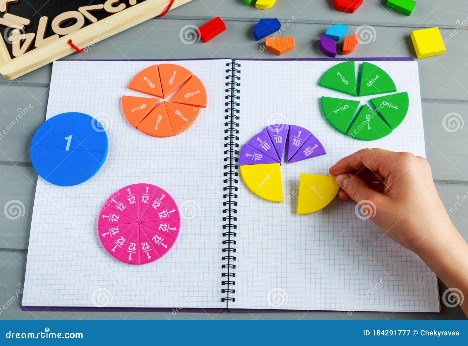 Kids Hand Moves Colorful Math Fractions on Gray Wooden Background or Table.  Interesting Creative Funny Math for Kids Stock Image - Image of  interesting, childhood: 184291777