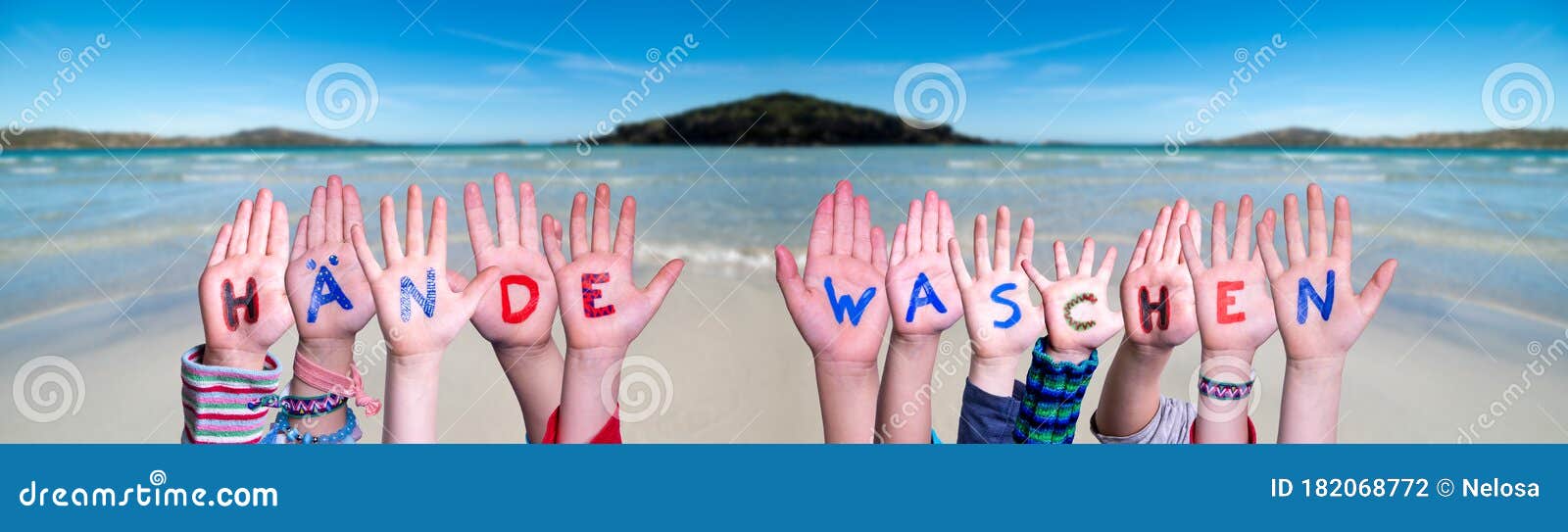 kids hands holding word haende waschen means wash your hands, ocean background
