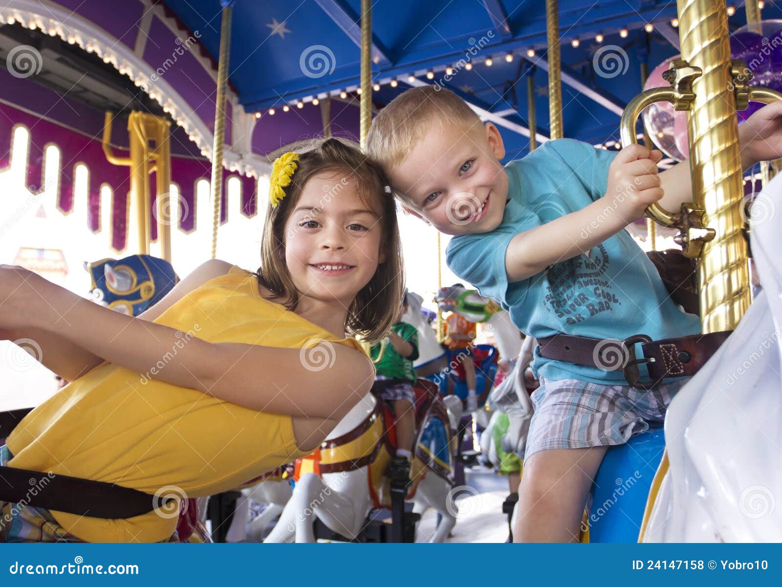 Kids Having Fun On A Carnival Carousel Royalty Free Stock Photos