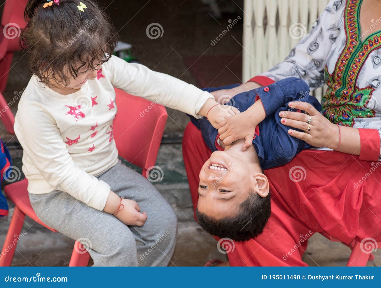 kids having fun at home, tickling and giggle.