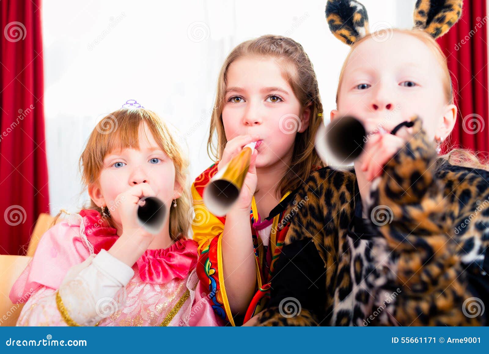 kids with noisemakers making noise on party