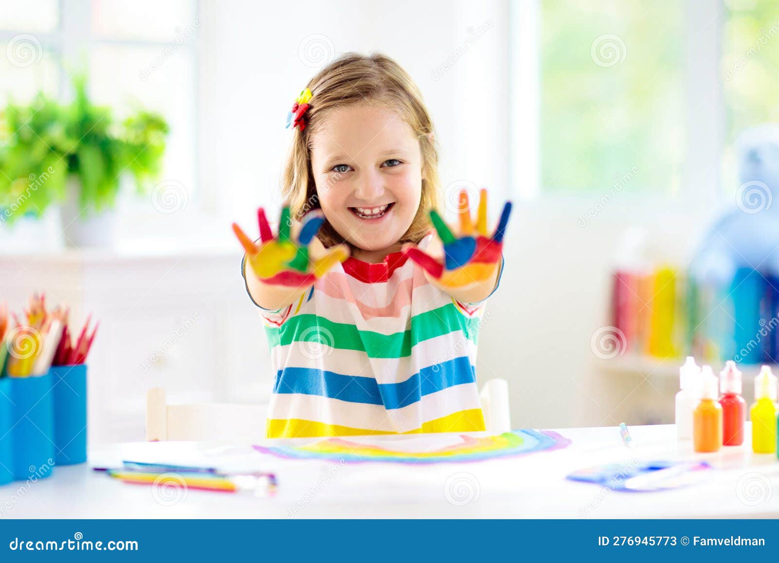 Kids Paint. Child Painting In White Sunny Study Room. Little Girl Drawing  Rainbow. School Kid Doing Art Homework. Arts And Crafts For Kids. Paint On  Children Hands. Creative Little Artist At Work.