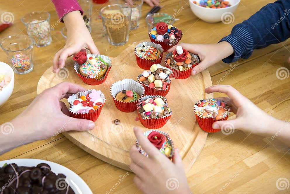 Kids Picking Cupcakes at Table Stock Photo - Image of cupcake, hands ...