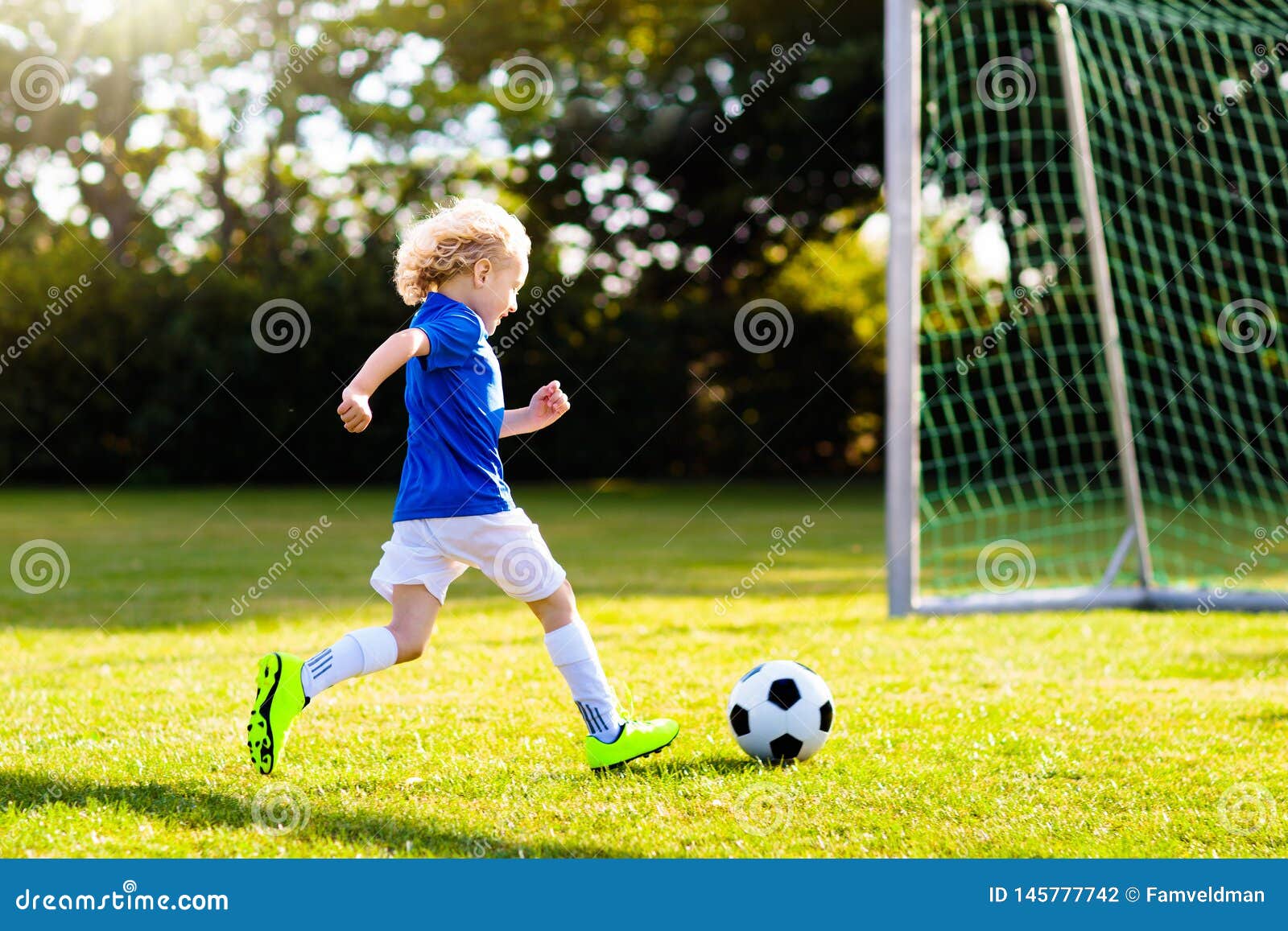 kids play football. child at soccer field