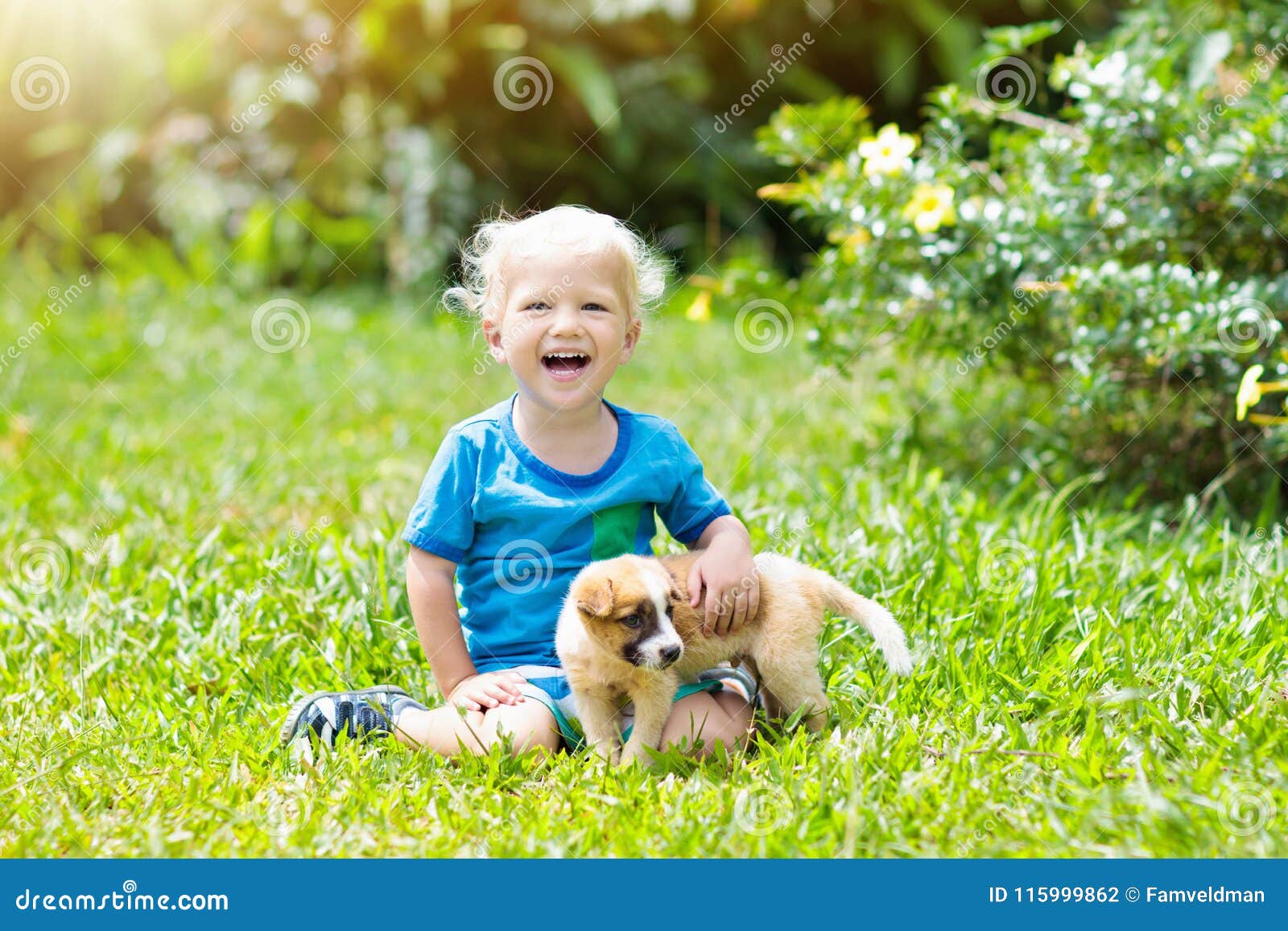 kids play with puppy. children and dog in garden.