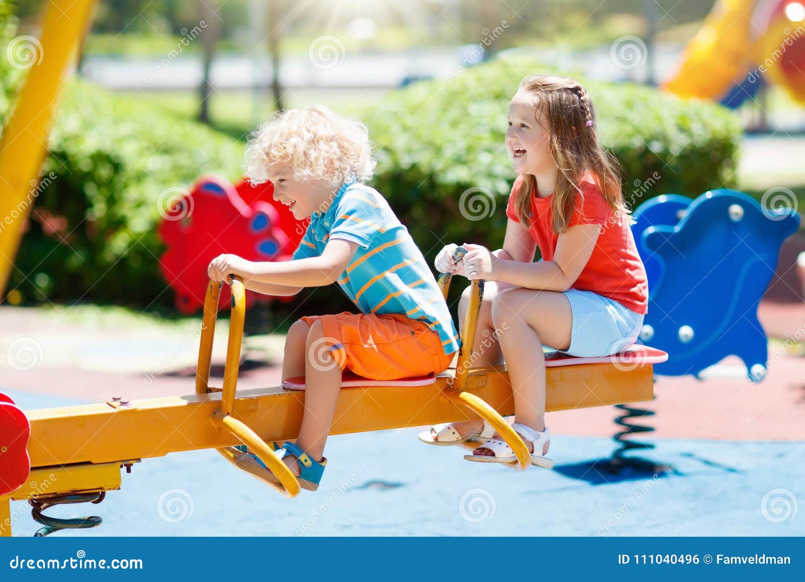kids on playground. children play in summer park.