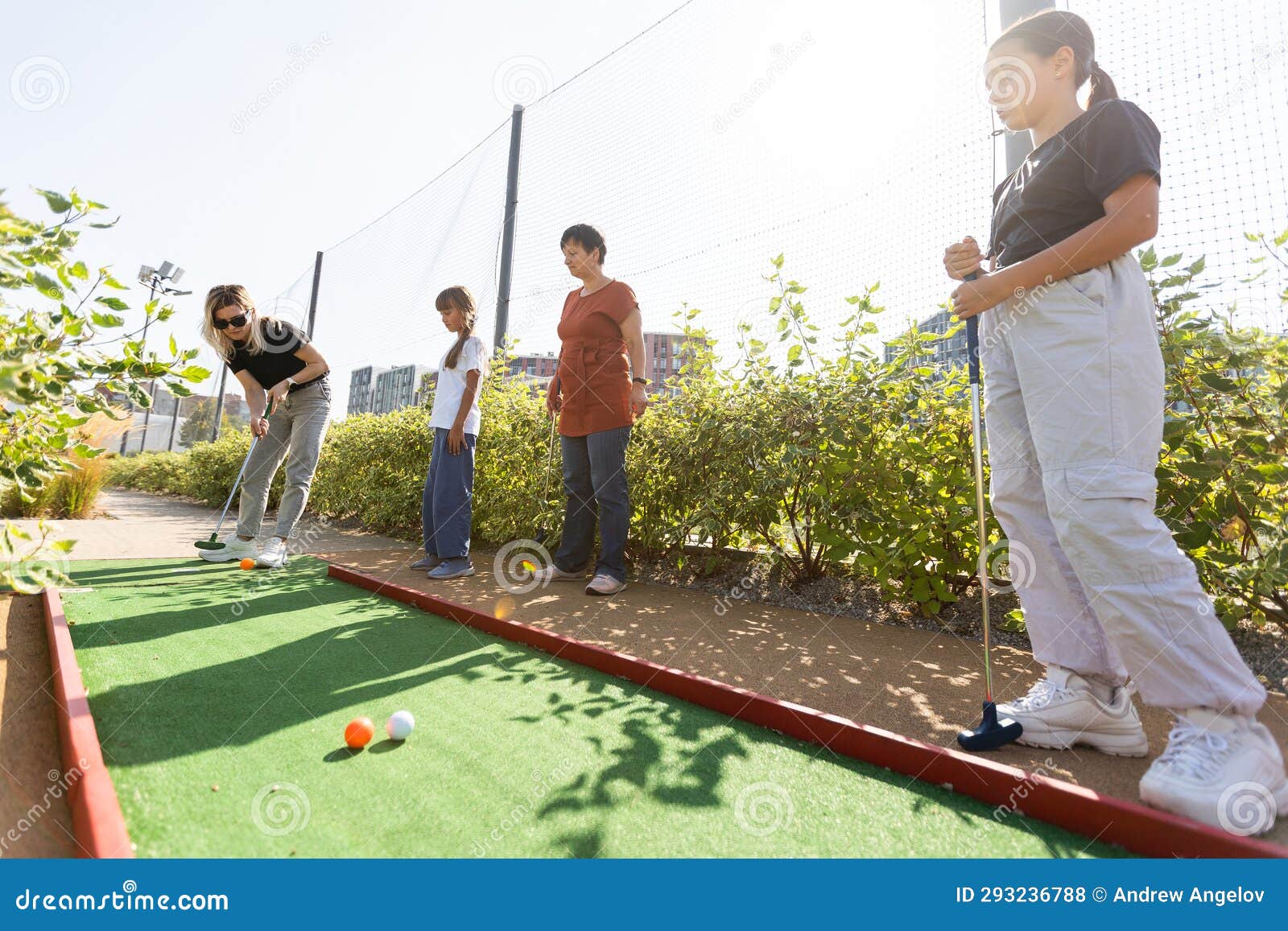 A group of children playing a game of mini golf photo – Group of kids Image  on Unsplash