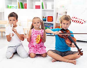 Kids Playing On Musical Instruments Royalty Free Stock Photography 