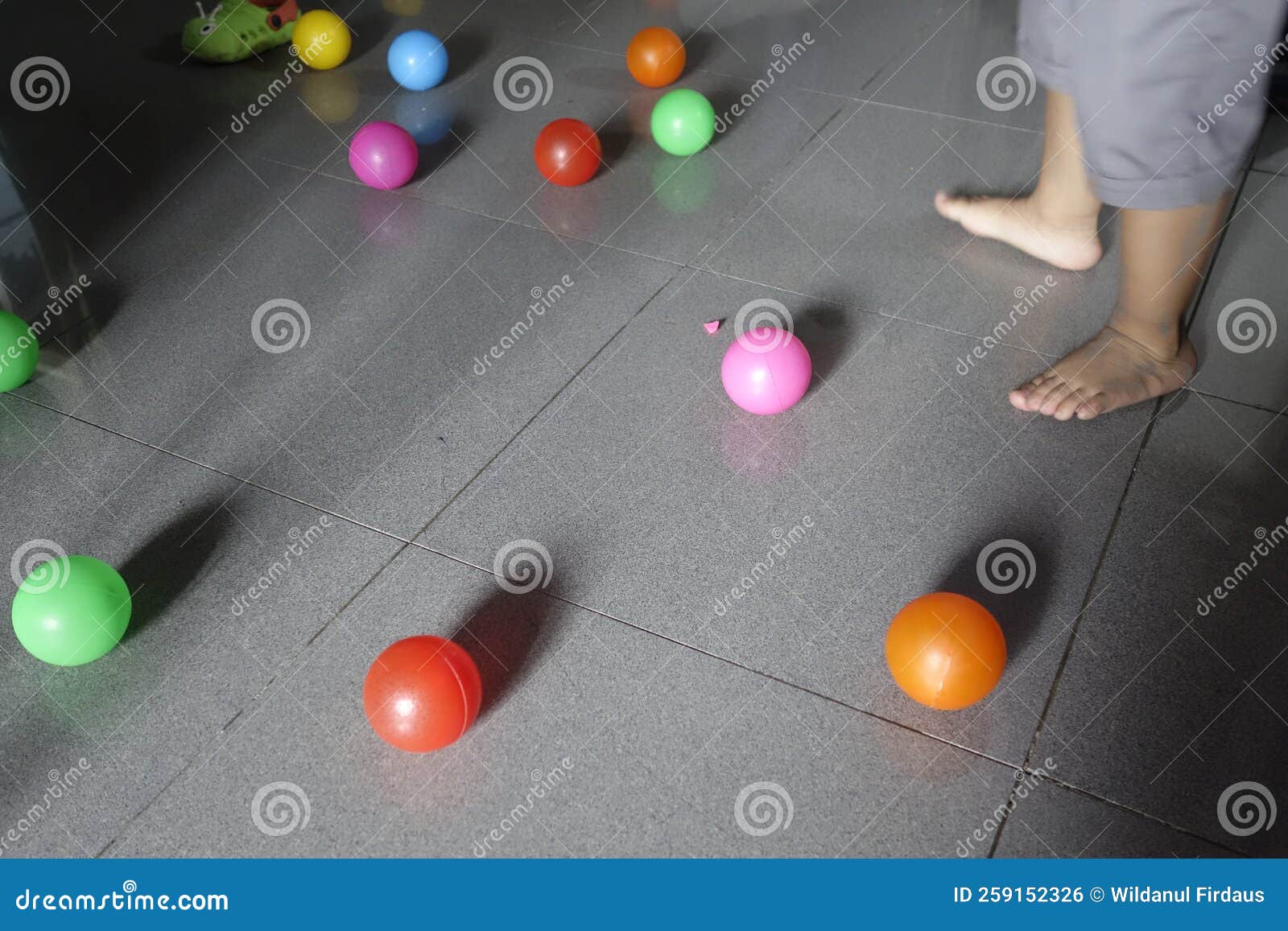 Kids Playing with the Plastic Colourful Ball on the Floor Stock Photo ...