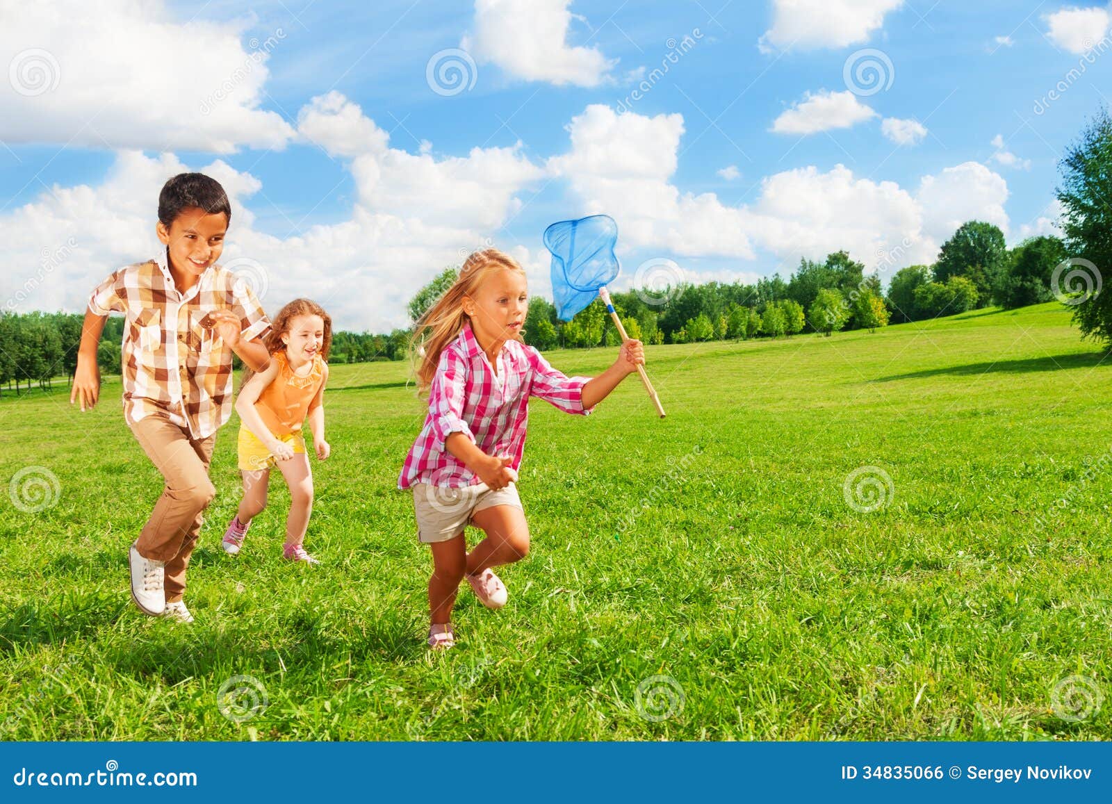 6 ,7 Kids Running with Butterfly Net Stock Photo - Image of