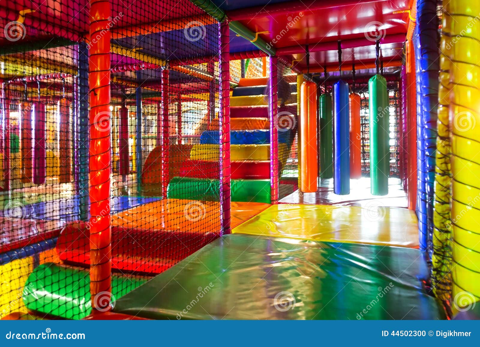 kids running inside a colorful indoor playground