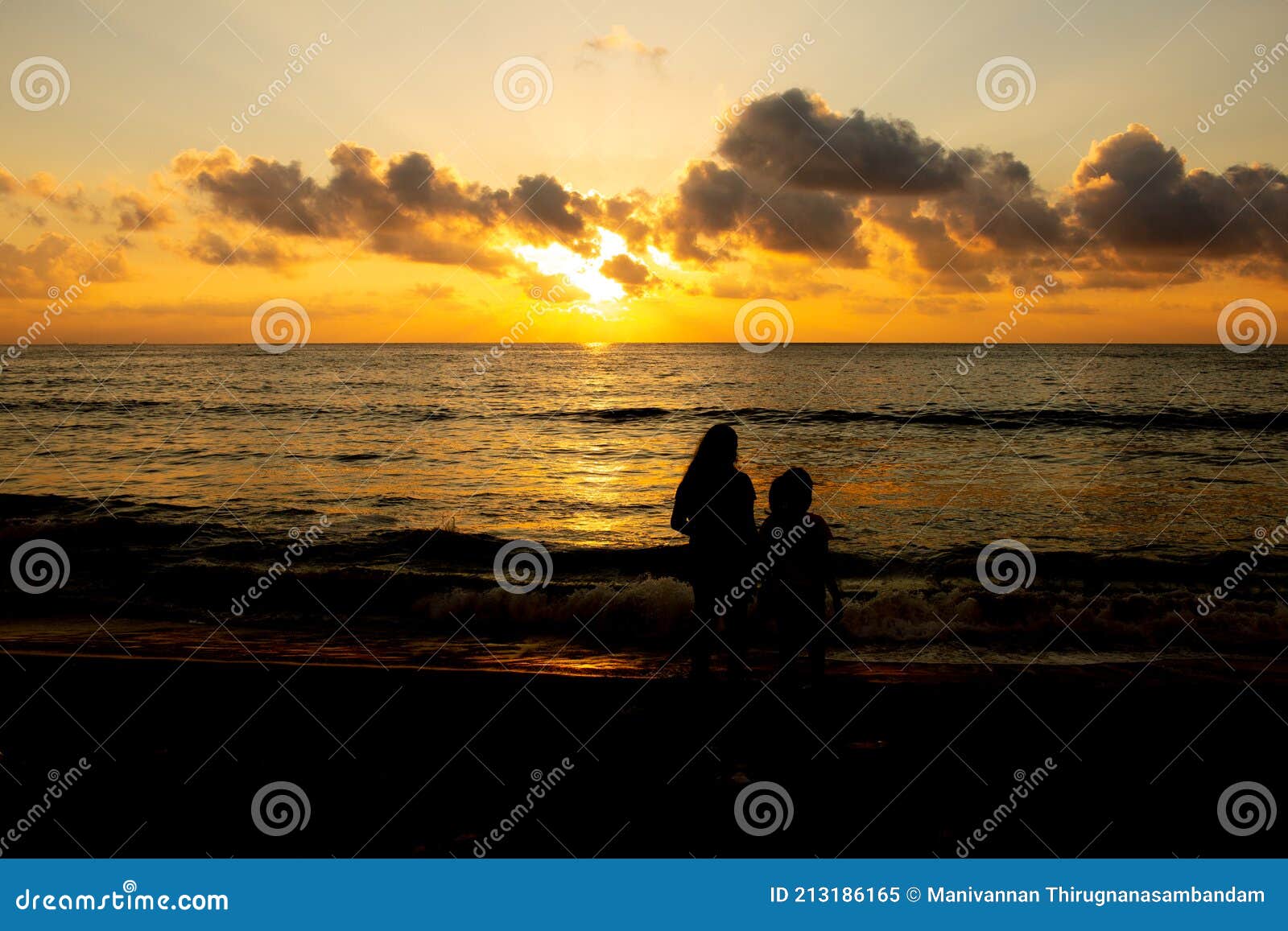 Kids in Silhouette Watching the Sunrise in Marina Beach, Chennai, India ...