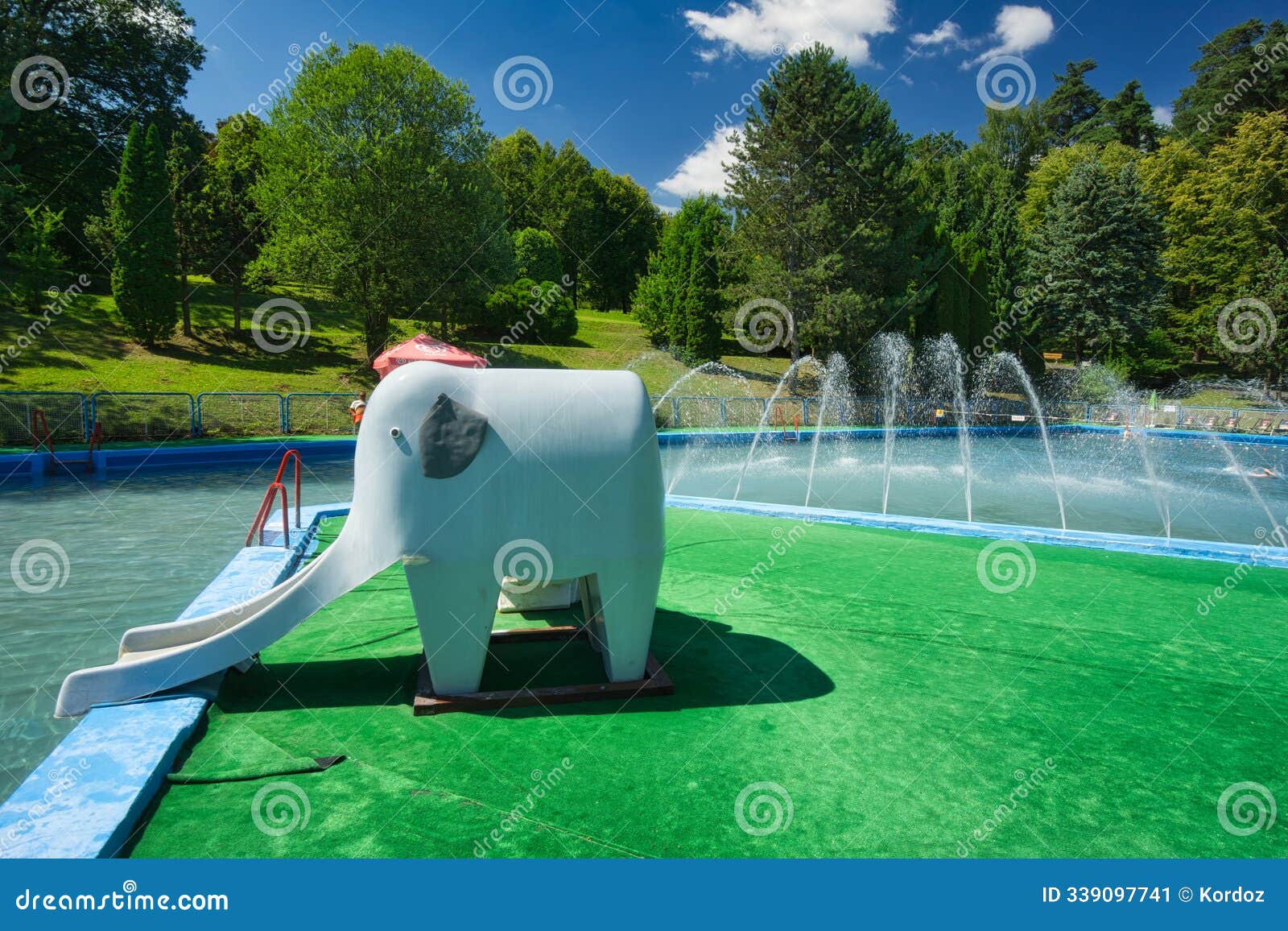 kids slide by outdoor swimming pool on holidaypark kovacova near zvolen during summer