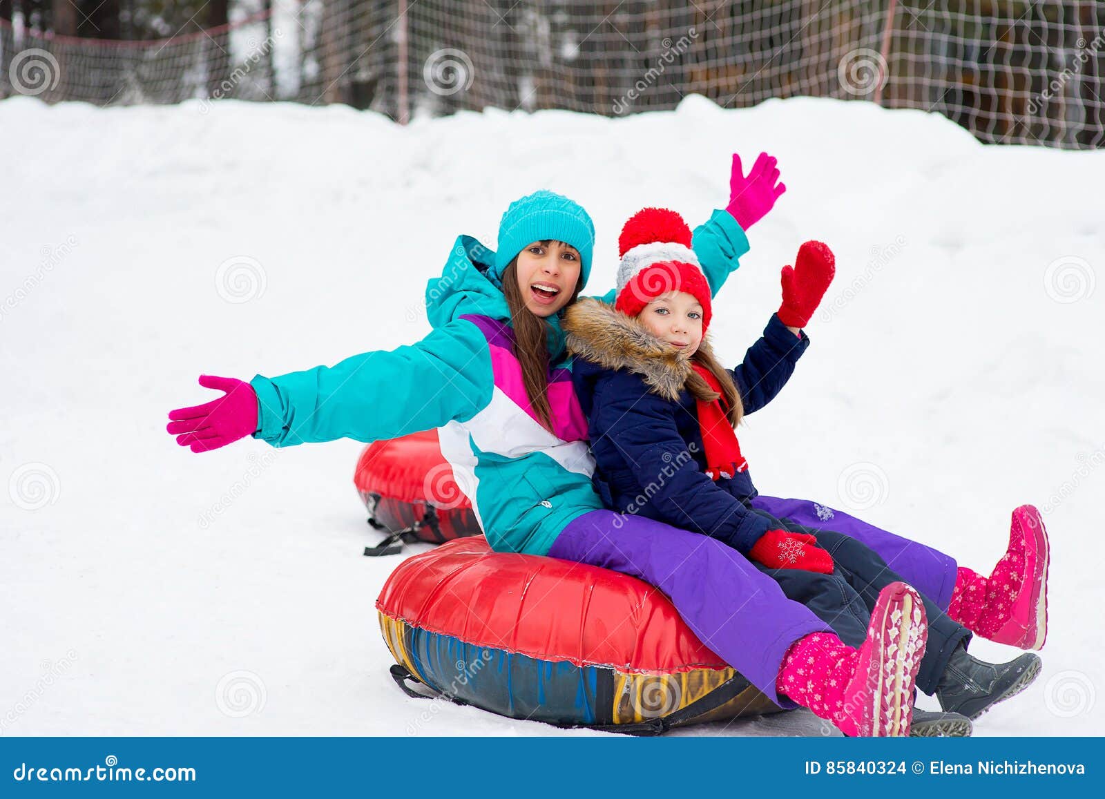 Kids on Snow Tubes Downhill at Winter Day Stock Photo - Image of forest ...