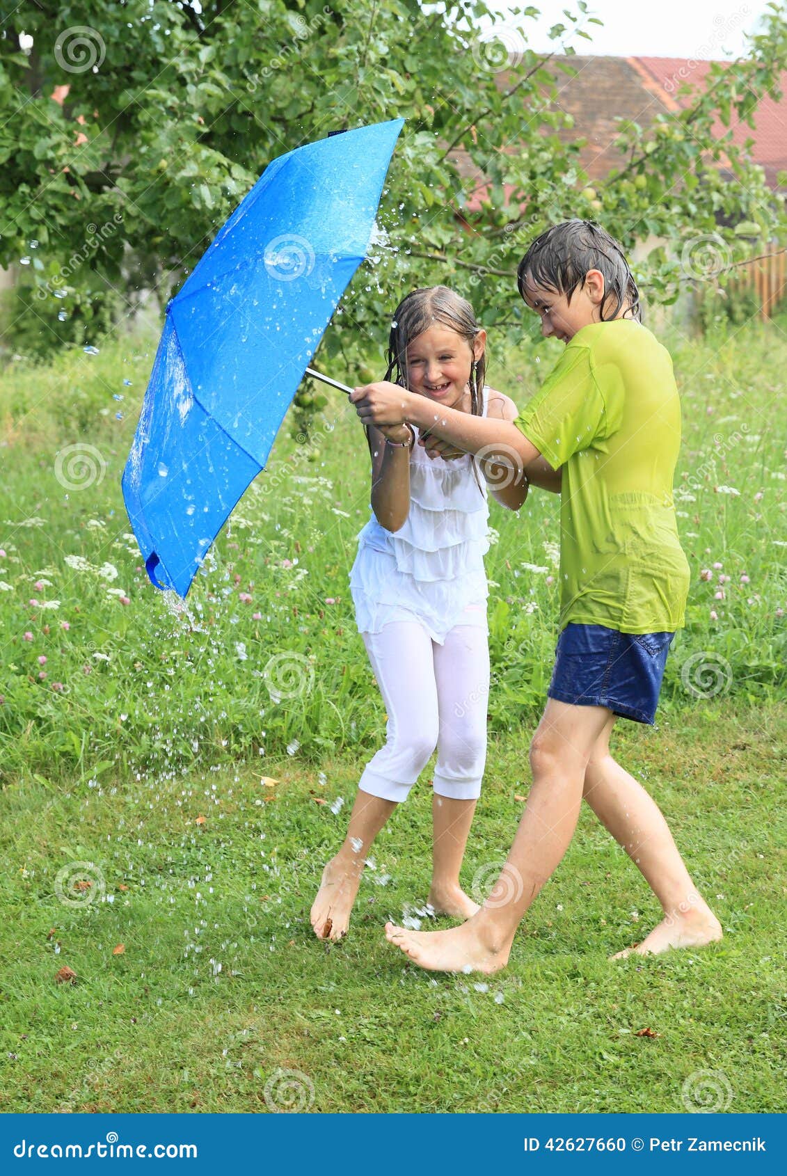 kids splashed with garden hose