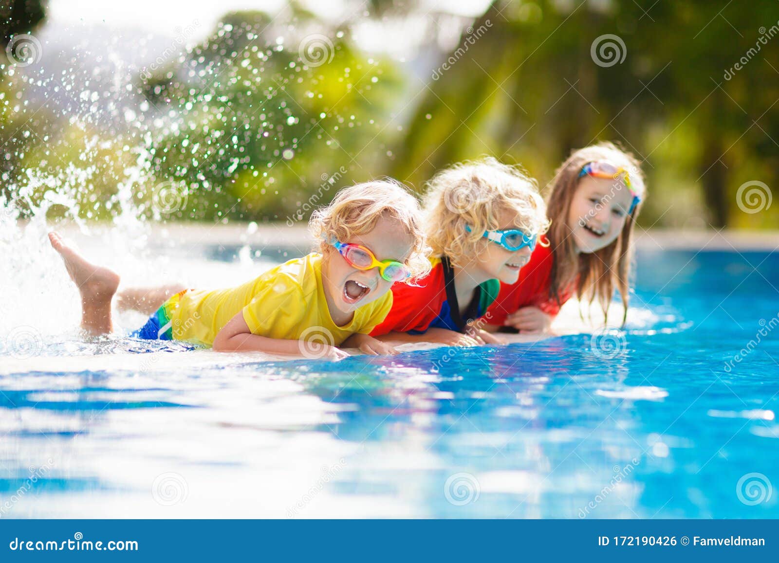 kids in swimming pool. children swim. family fun