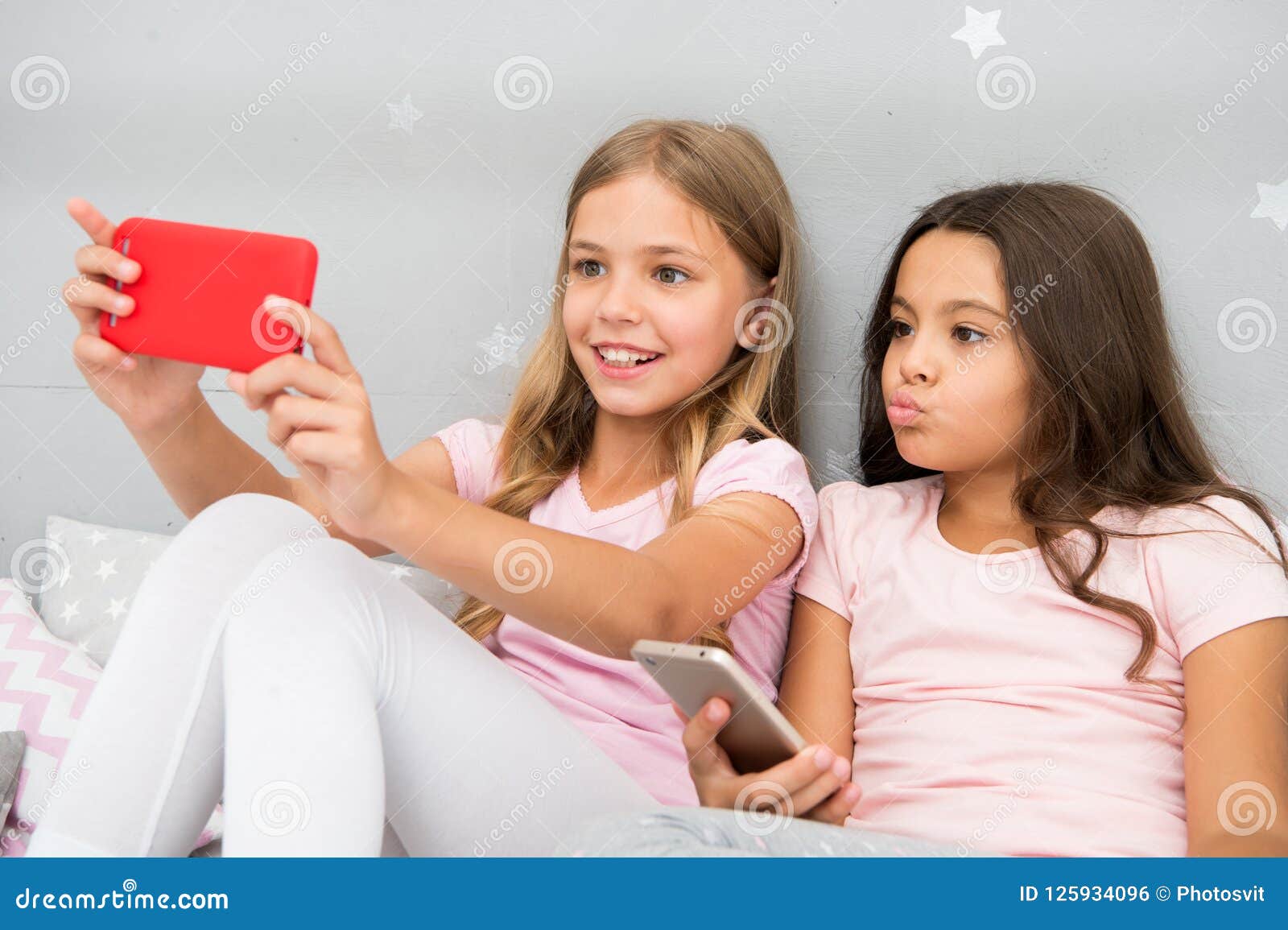 Kids Taking Selfie in Bedroom. Pajamas Party Concept. Girlish Leisure ...