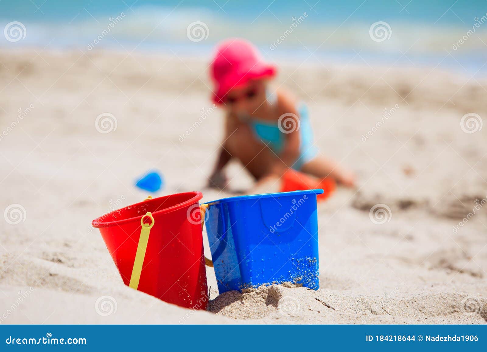 Kids Toys and Little Girl Play with Sand on Beach Stock Photo - Image ...