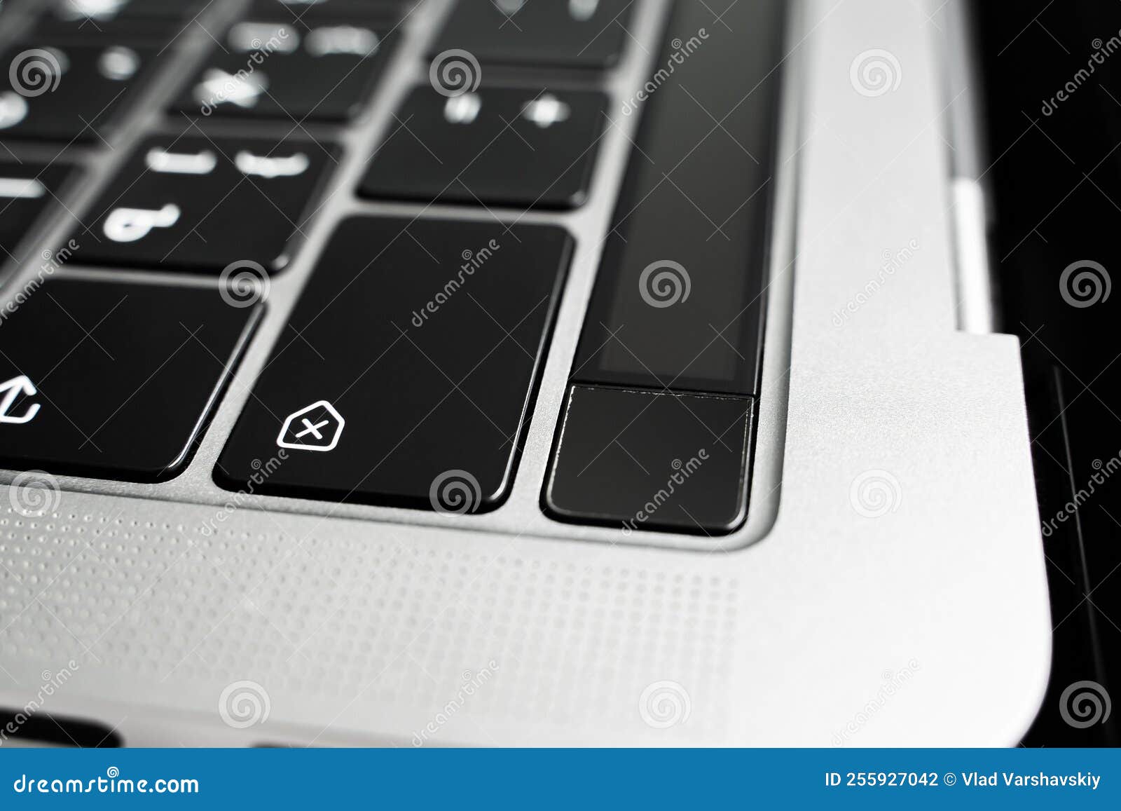 kiev, ukraine - august 9, 2022: fingerprint sensor on macbook pro with touchbar close up. touch id on apple laptop