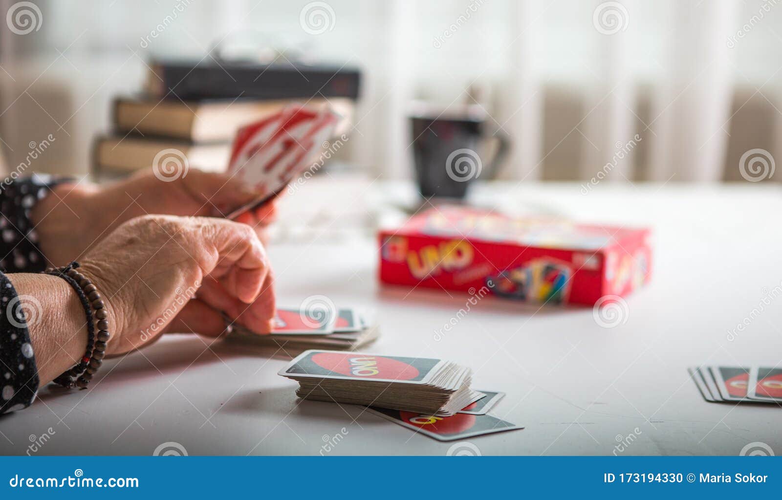 Uno cards in hand, card game Stock Photo by ©Egor_1896 239236398