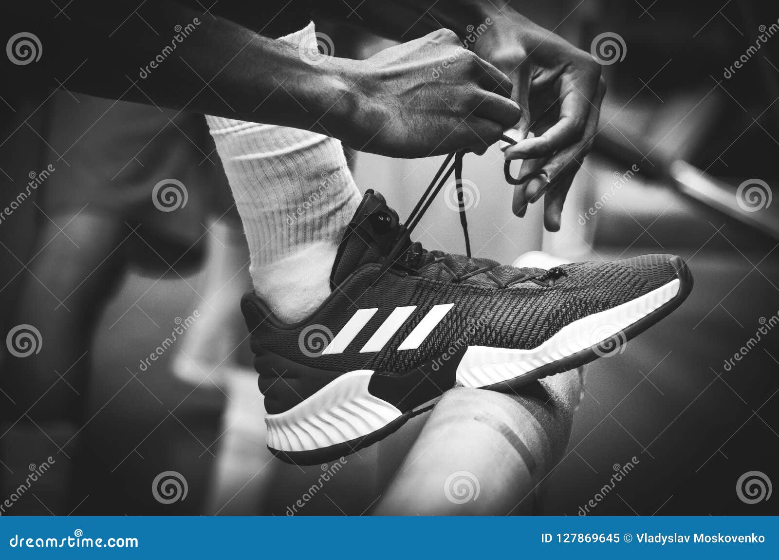tying adidas shoes