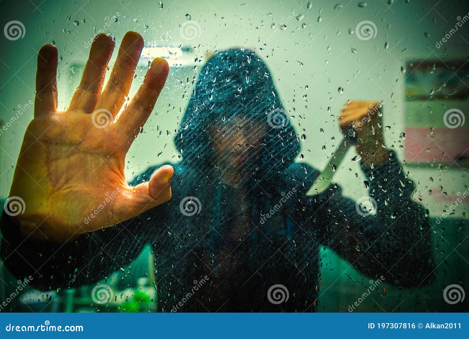 Killer with a Long Knife Seen Behind the Shower Glass Stock Photo