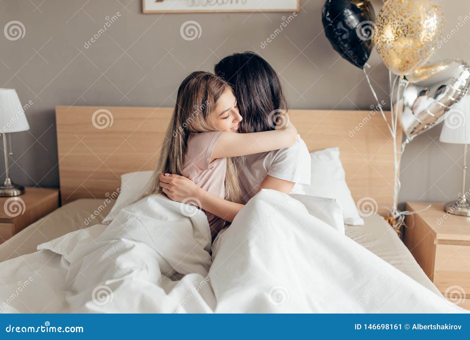 Kind Sister Kissing Her Elder Sister Good Night. Stock Image ...