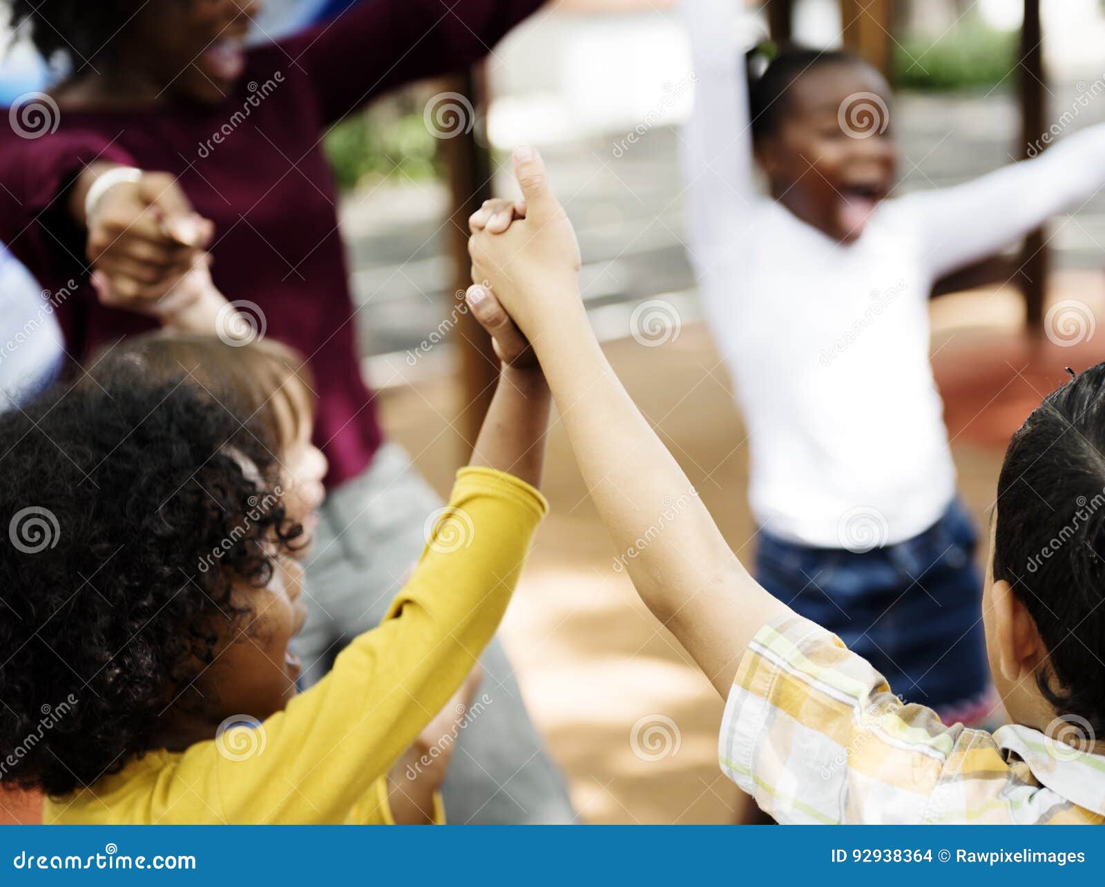 Kindergarten Students with Arms Raised Stock Photo Image of learning
