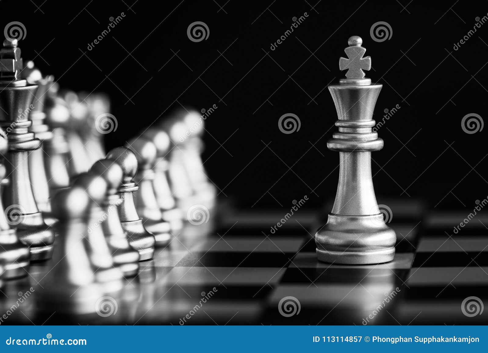 The King in battle chess game stand on chessboard with black