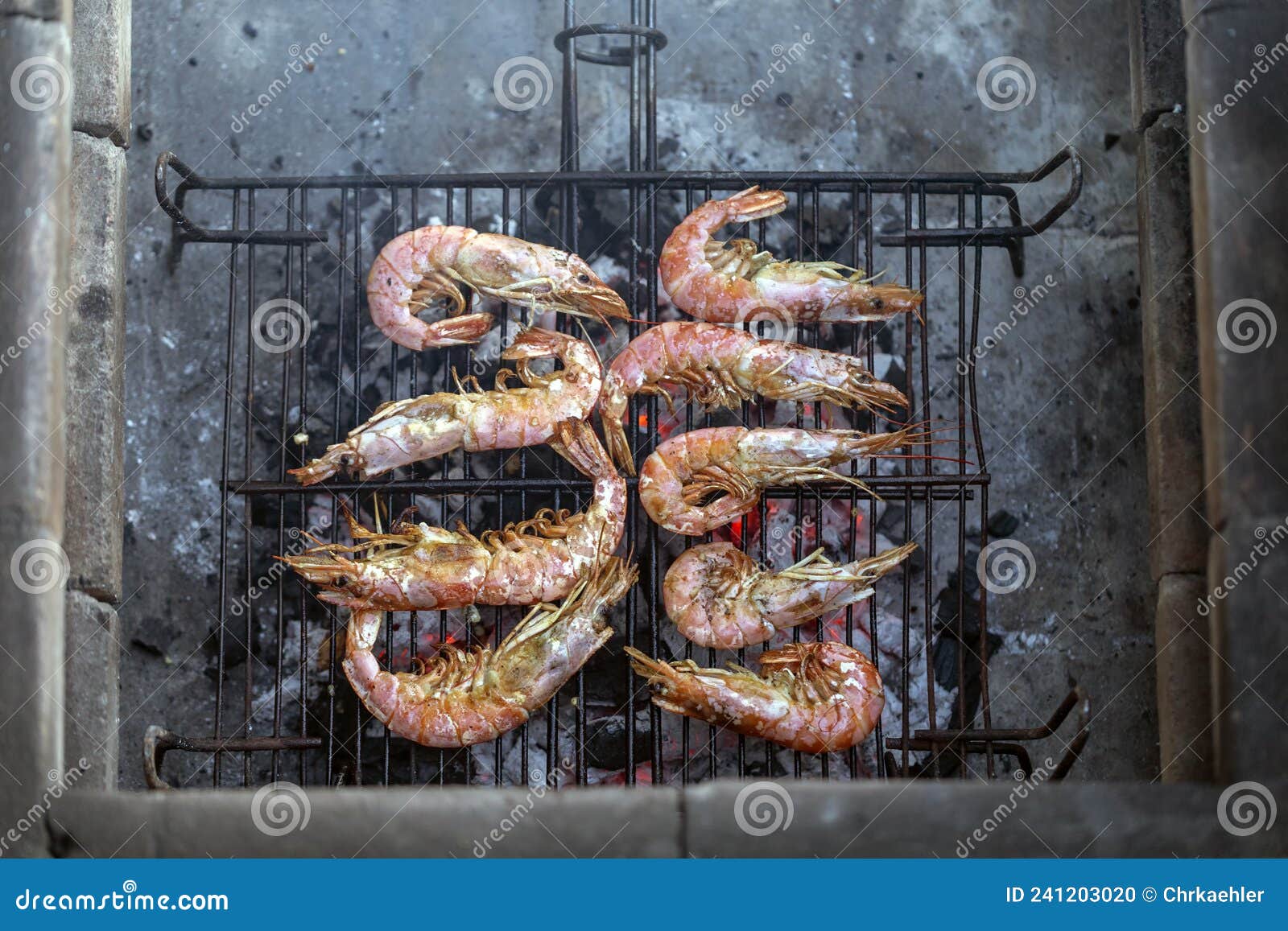 King prawns on a barbecue stock photo. Image of cooking 241203020