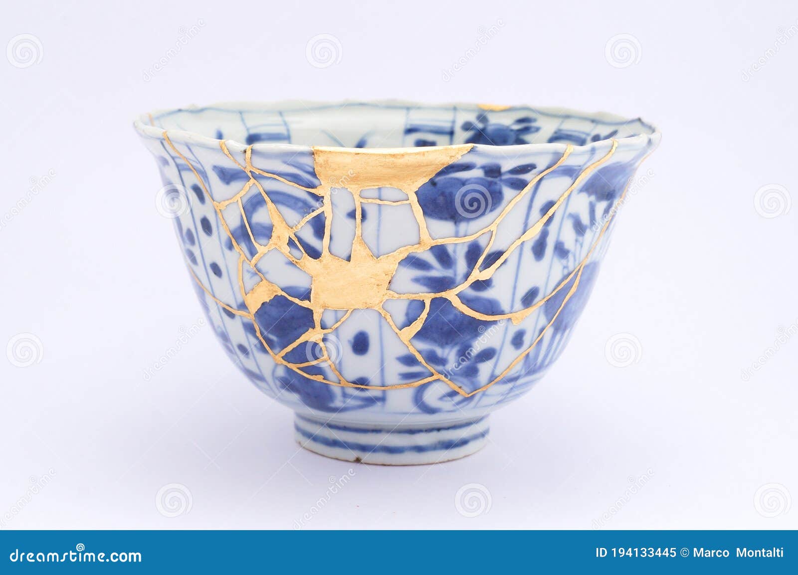 kintsugi antique japanese bowl restored with gold.