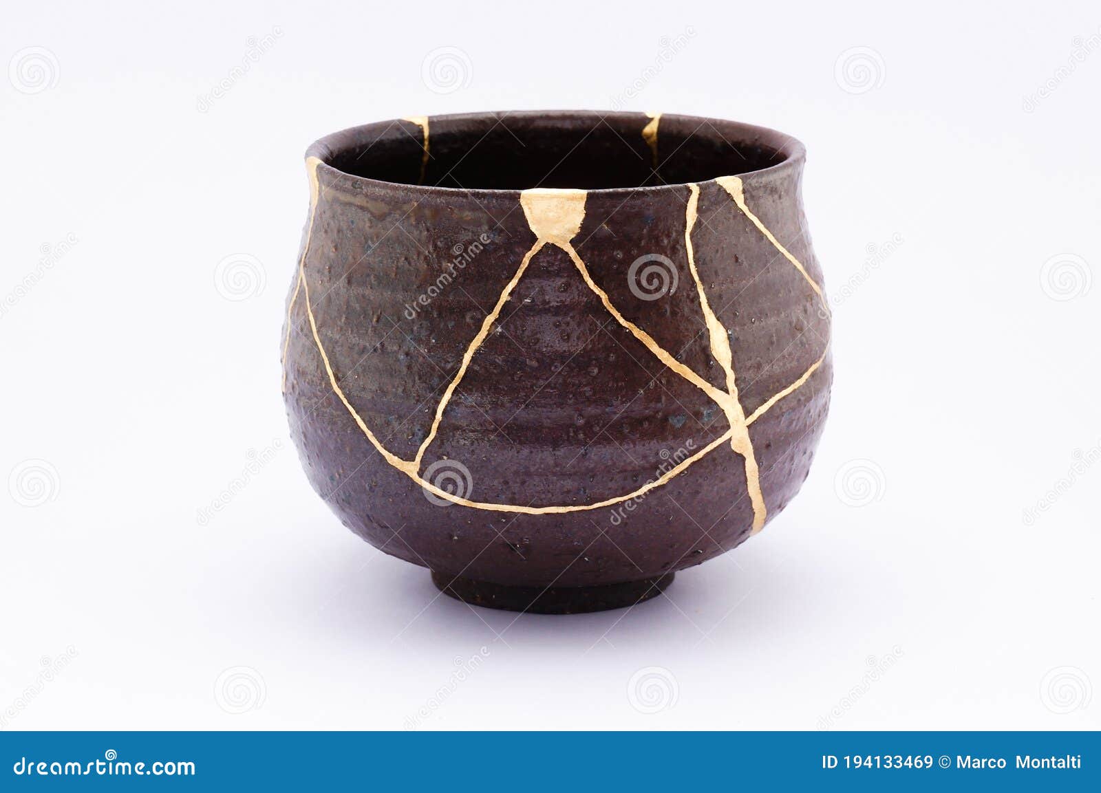 kintsugi antique japanese chawan restored with gold.