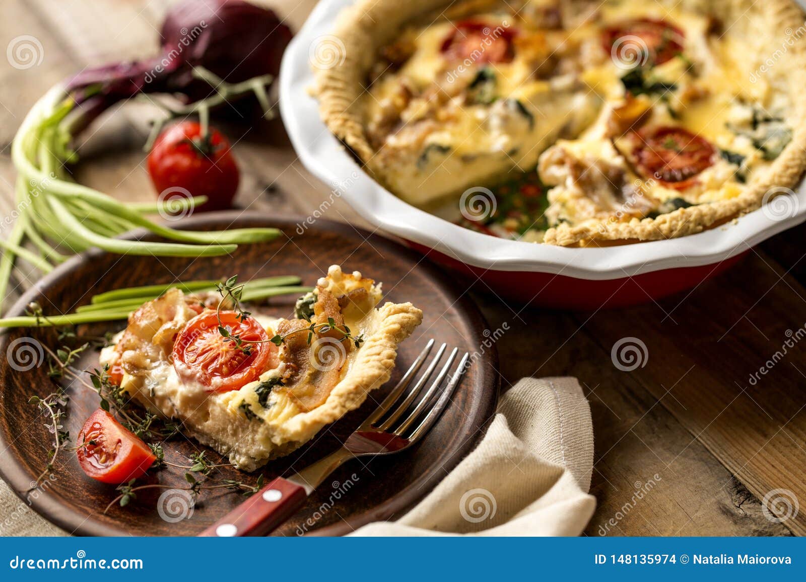 Kish Open Pie with Tomatoes, Bacon, Spinach in White Baking Dish Stock ...