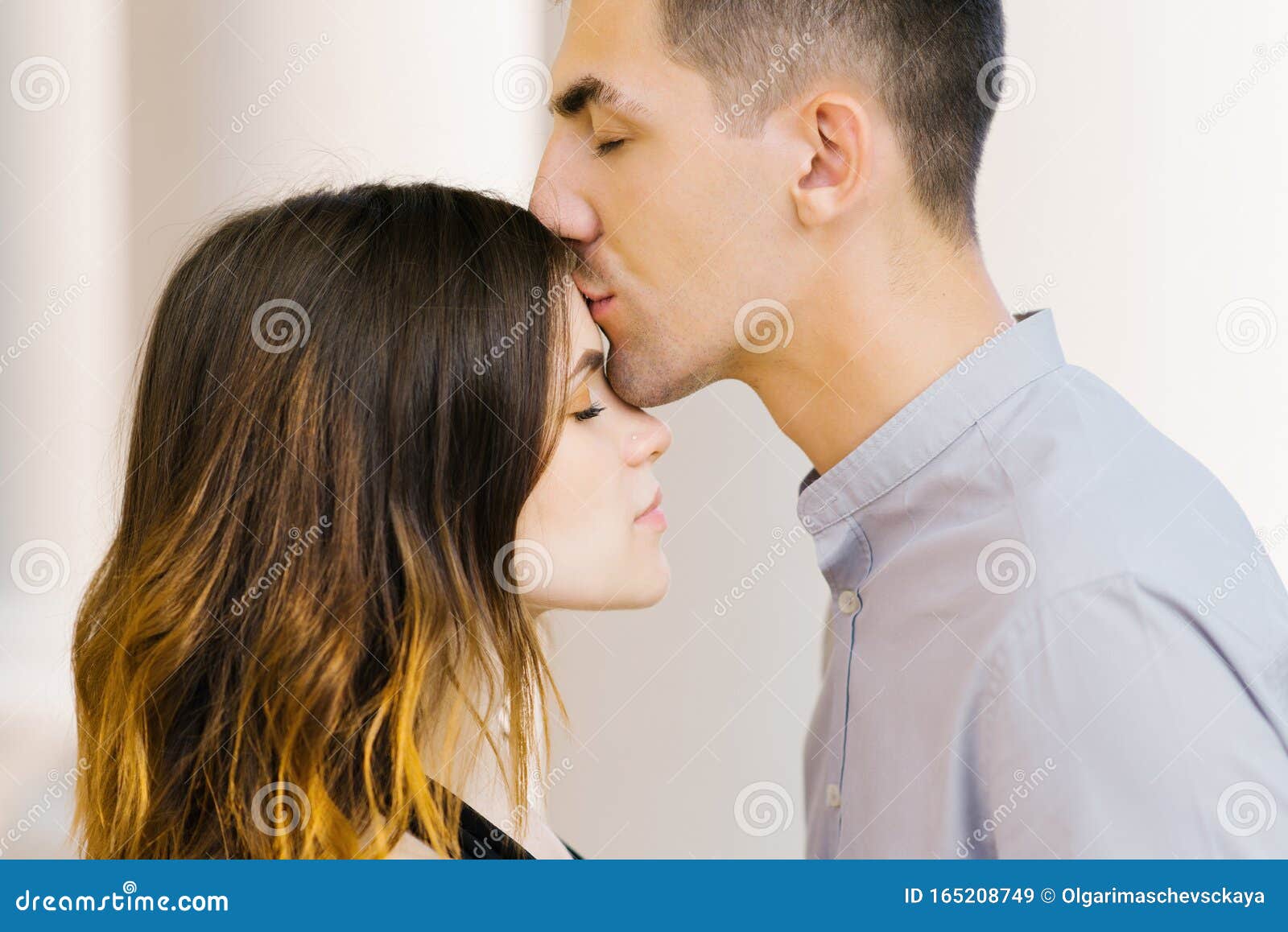 Kiss A Beautiful Couple In Love On The Forehead Stock