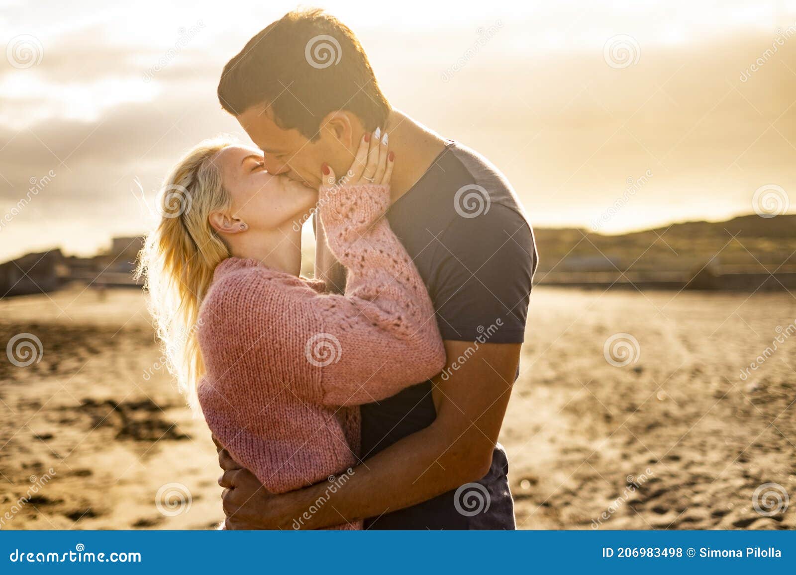 Kiss and Love Couple Outdoor with Two Young Man and Woman Kissing and  Hugging in a Golden Sunset Background - People Enjoy Stock Photo - Image of  forever, protection: 206983498