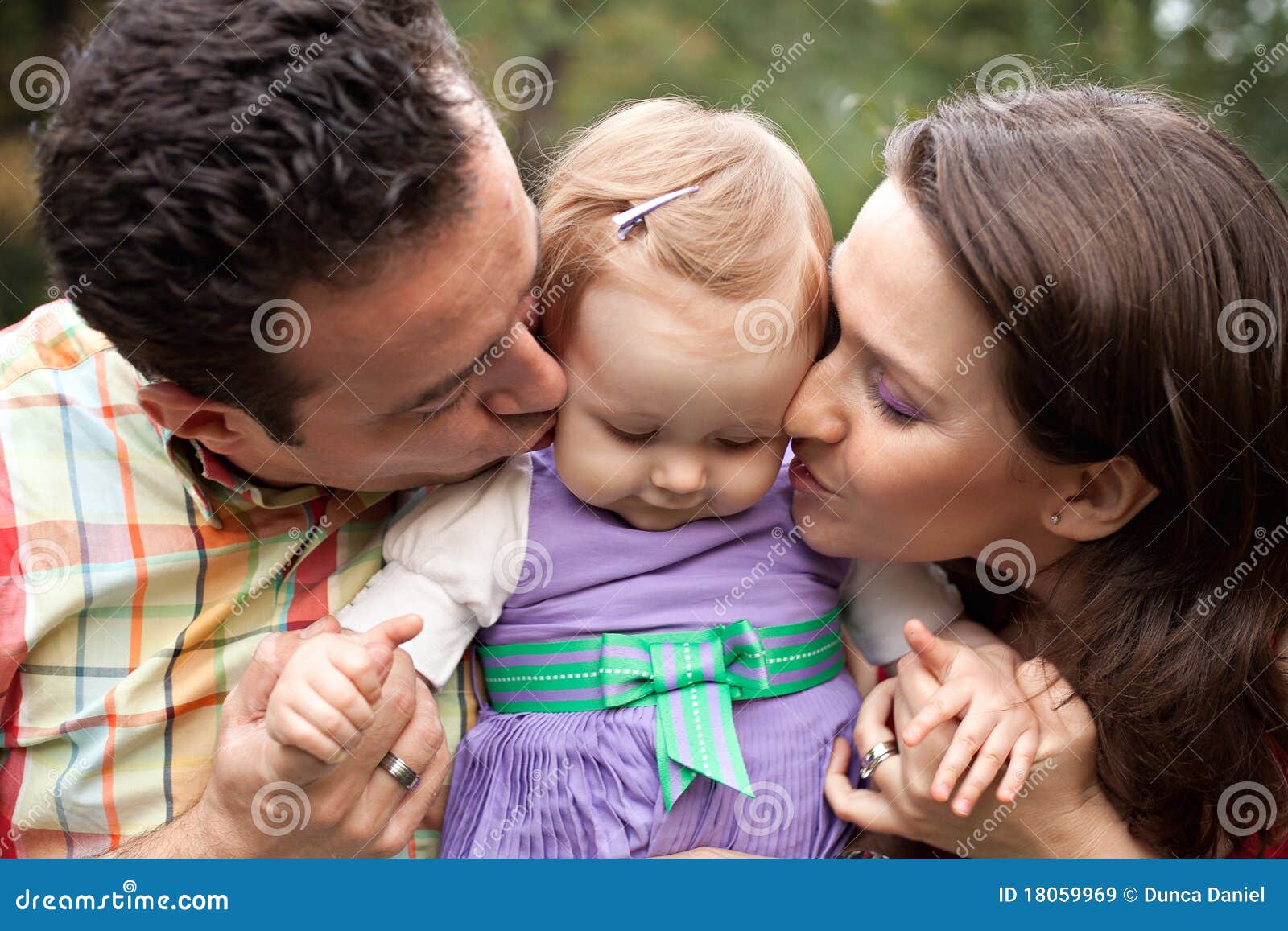 Kiss of Love - Parents with Their Baby Girl Stock Image - Image of ...