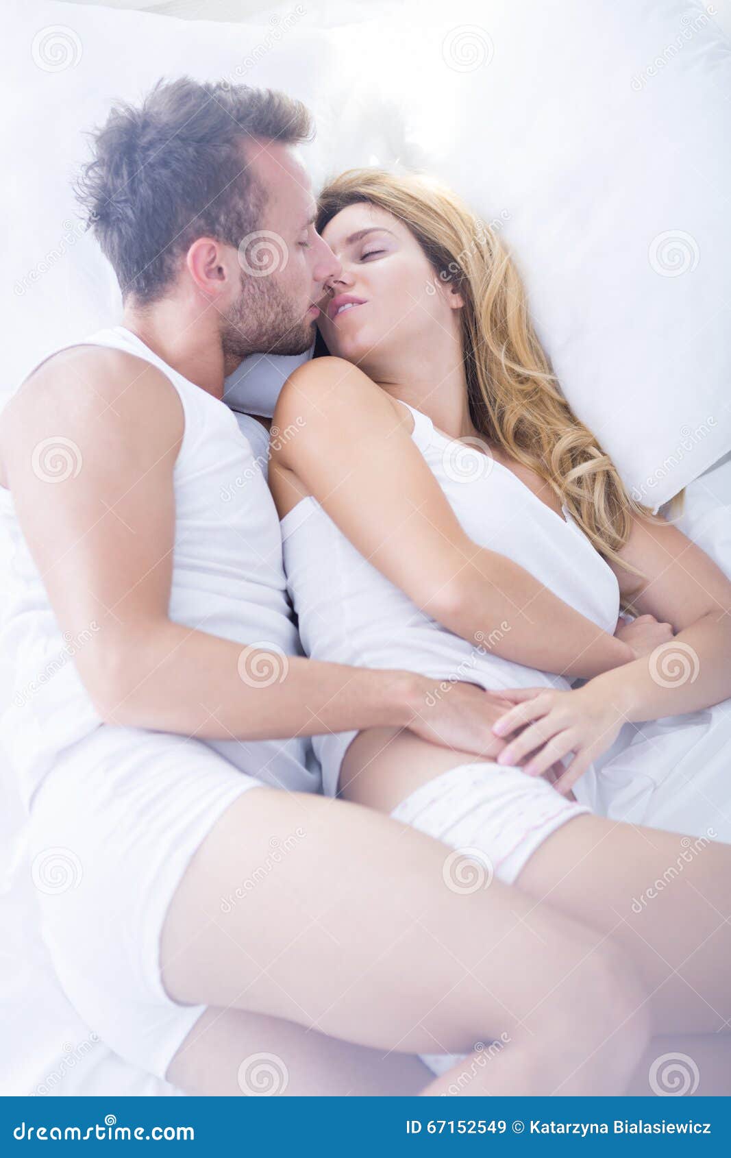 Kissing in bed stock image picture