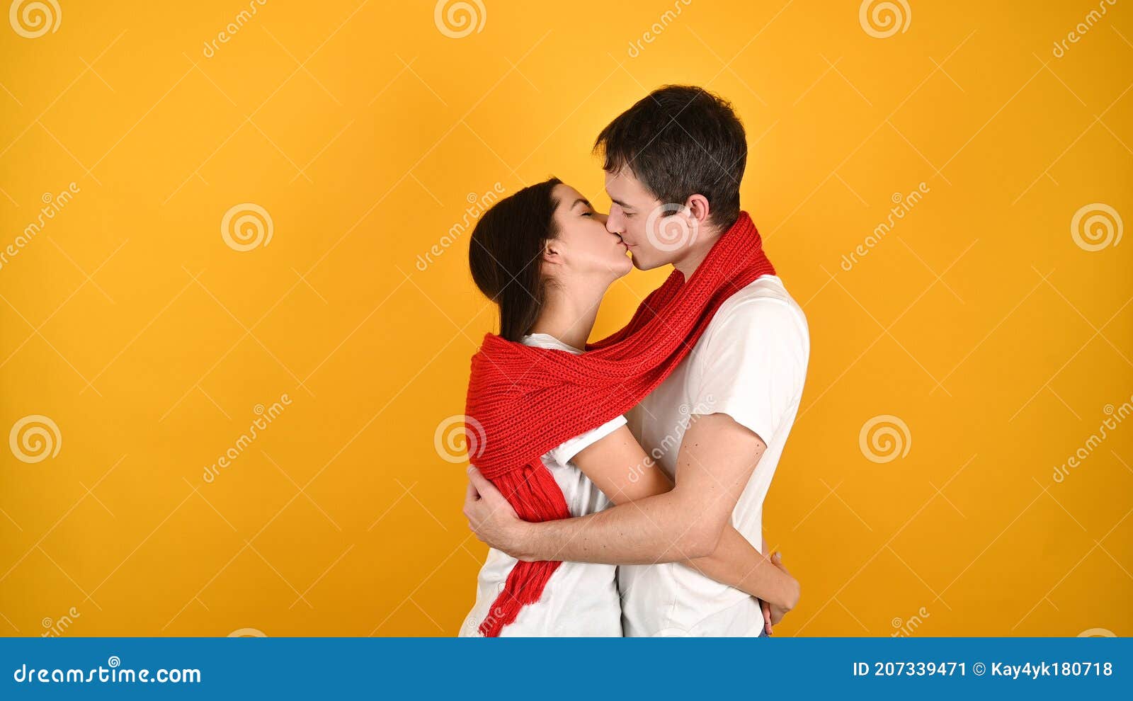 Kissing Young Couple On A Yellow Background Stock Image Image Of Human Indoor 207339471 