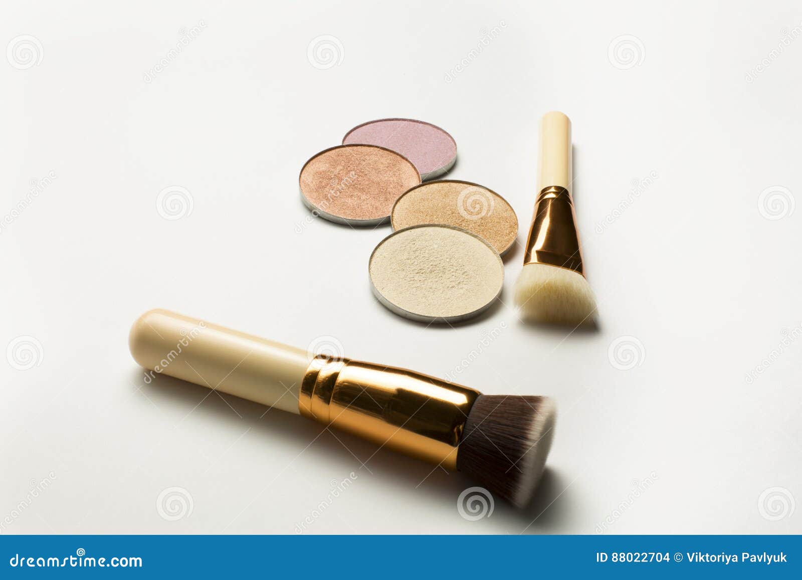 Kit of Highlighters with Cosmetic Brushes Over a White Background Stock