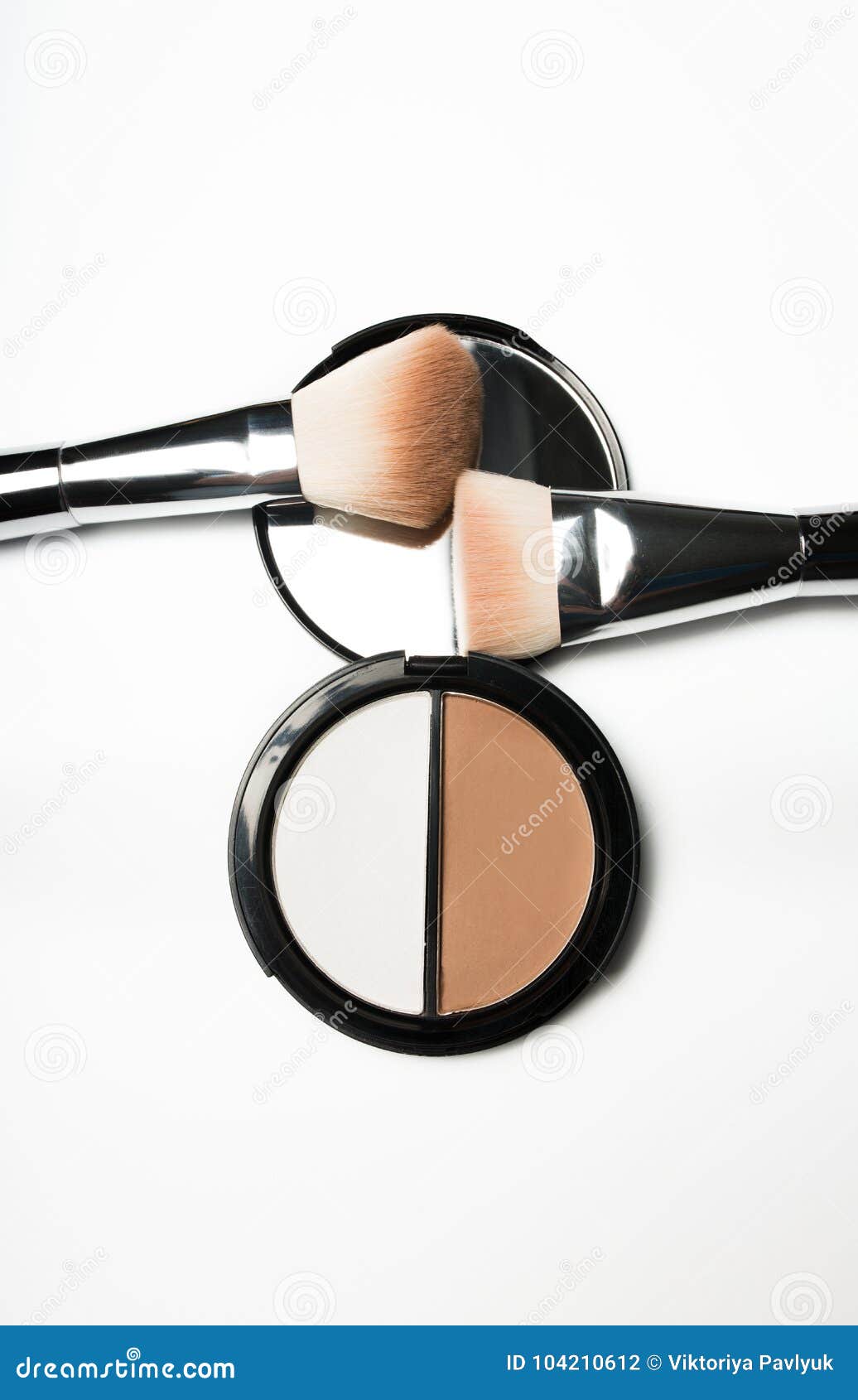 Kit of Bronzer and Highlighter with Cosmetic Brushes on a White Stock